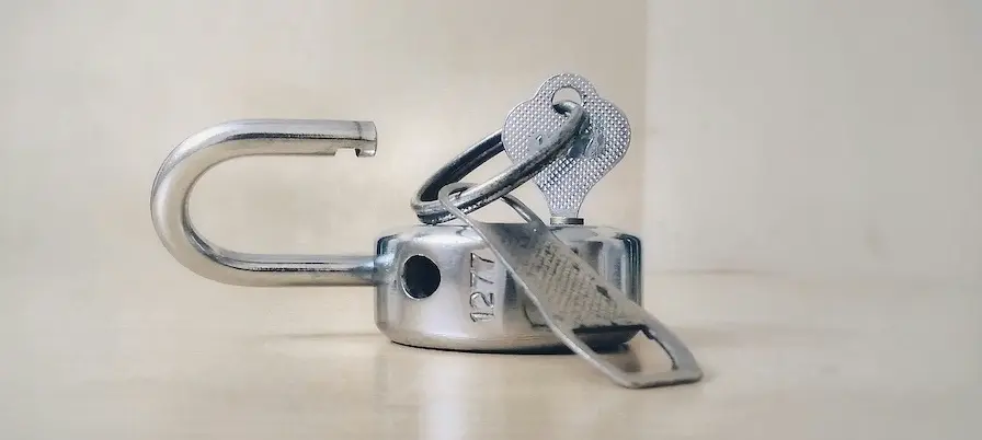 A key opening a lock and opening the door to small business freedom