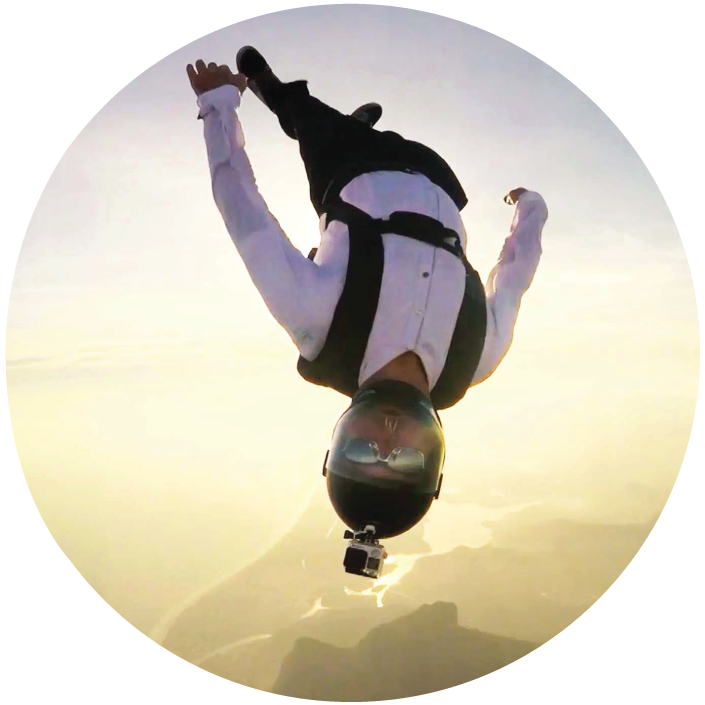 A businessperson who is skydiving.