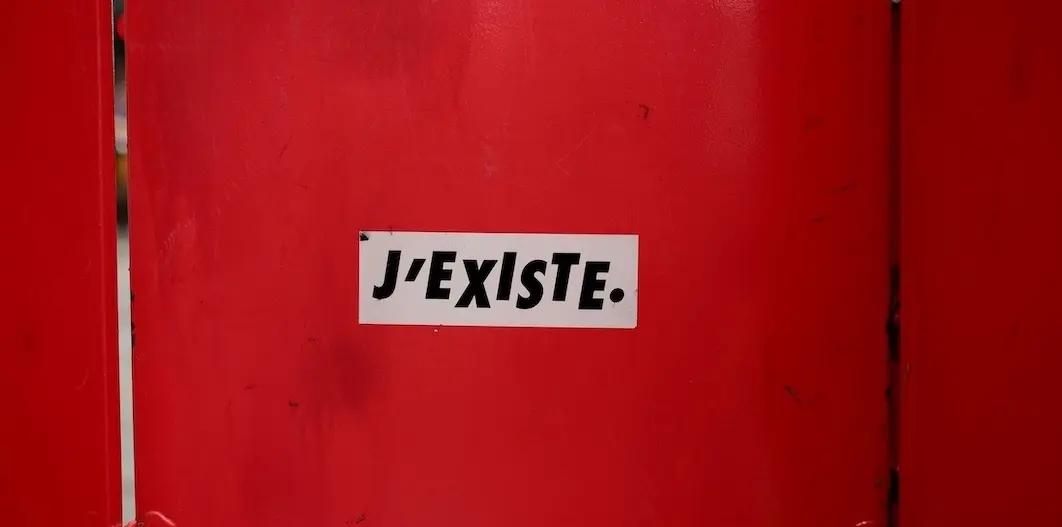 A sign saying I exist that represents why your small business is invisible and you can fix it