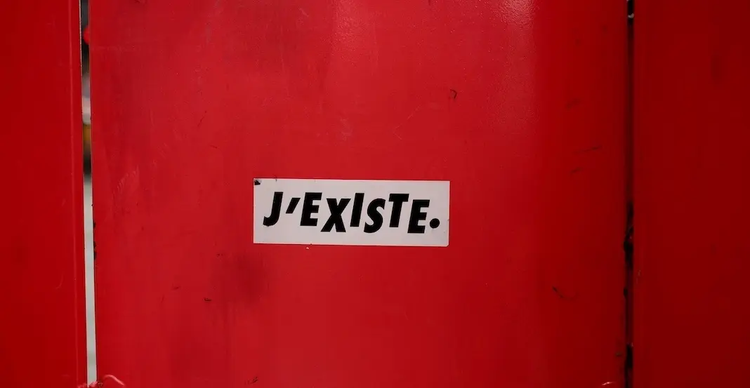 A sign saying I exist that represents why your small business is invisible and you can fix it