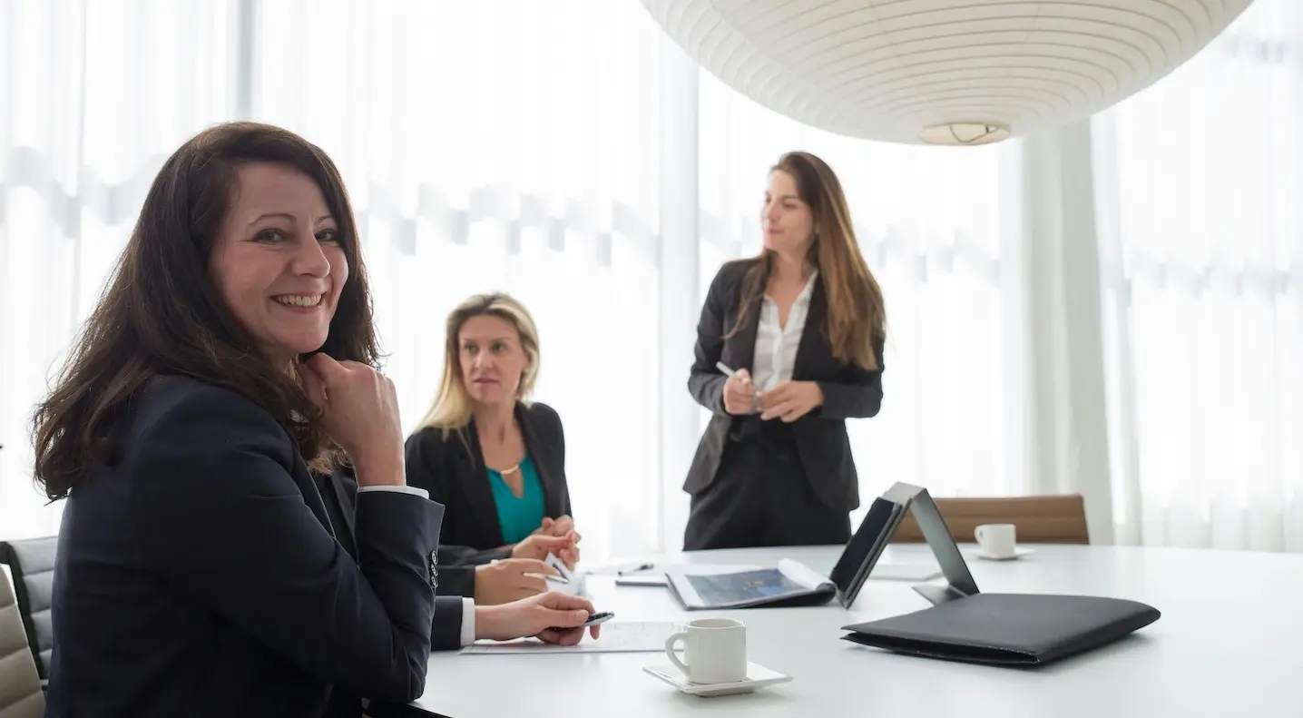 Businesspeople talking about 5 ways to sell their professional services.